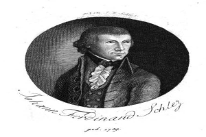 Ein Schwarz-Weiß-Porträt von Johann Ferdinand Schley, einem deutschen Komponisten, der einen Mantel trägt, mit begleitendem Text.