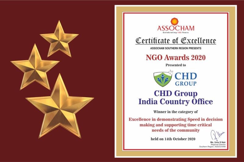 Auszeichnung für den NGO Award 2020, mit dem Text "Chd Group India Country Office" und einem Schild-Logo mit einem zentralen Stern und einem Lorbeerkranz, flankiert von drei Sternen auf der linken Seite.